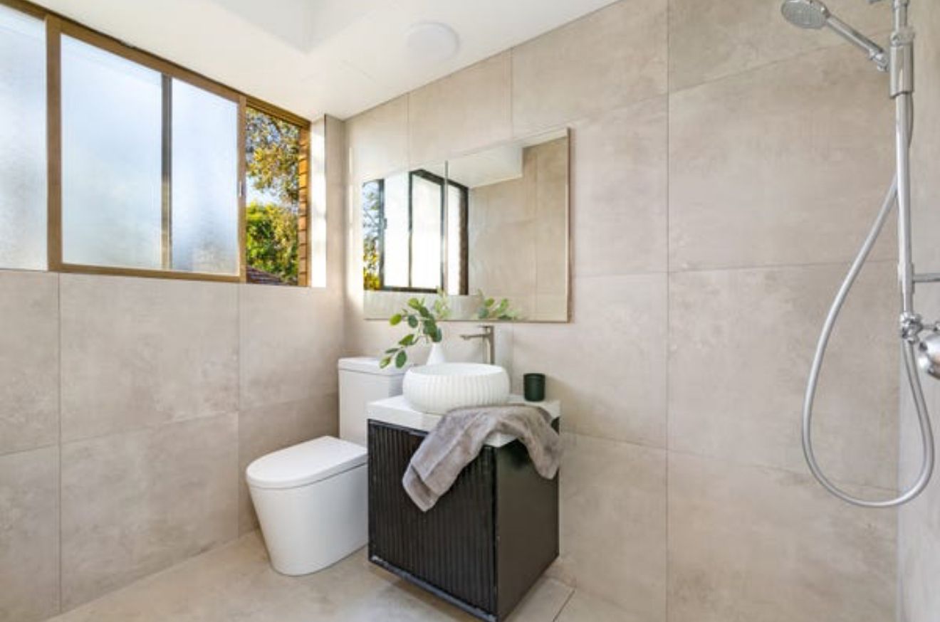 Bathroom — Concrete-Look Tile & Fluted Vanity